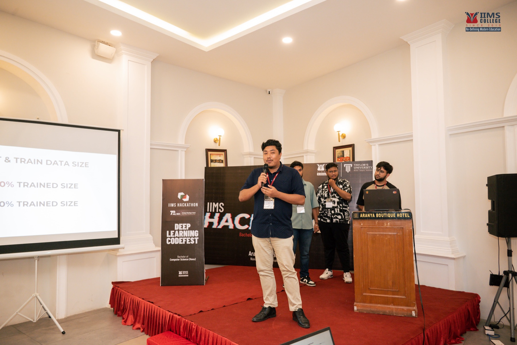 Students presenting their autonomous-vehicle model to the room